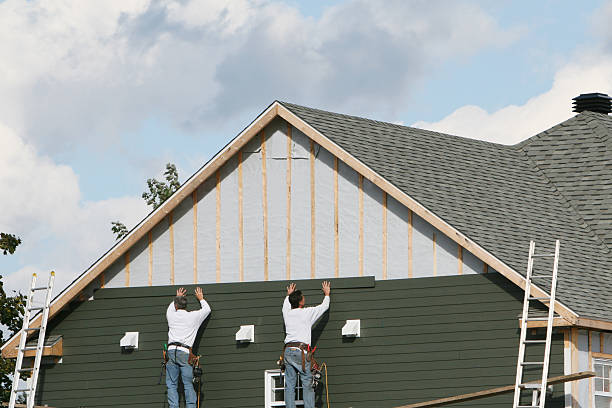 Professional Siding technician working in Brookline, MA